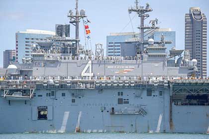 SAN DIEGO (May 1, 2019) Sailors and Marines aboard the amphibious assault ship USS Boxer (LHD 4) depart Naval Base San Diego, May 1, 2019, for a scheduled deployment. Boxer is the flagship of the Boxer Amphibious Ready Group, which also includes the amphibious transport dock ship USS John P. Murtha (LPD 26) and the amphibious dock landing ship USS Harpers Ferry (LSD 49), as well as the 11th Marine Expeditionary Unit (MEU). The ARG/MEU team will conduct maritime security operations, crisis response operations, theater security cooperation and forward naval presence operations while deployed. U.S. Navy photo by MC2 Alex Millar.