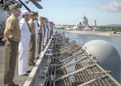 PEARL HARBOR (Nov. 13, 2019) Sailors and Marines aboard the amphibious assault ship USS Boxer (LHD 4) man the rails before a scheduled port visit to Pearl Harbor, Hawaii. The Boxer Amphibious Ready Group (ARG) and 11th Marine Expeditionary Unit (MEU) are deployed to the U.S. 7th Fleet area of operations to support regional stability, reassure partners and allies, and maintain a presence to respond to any crisis ranging from humanitarian assistance to contingency operations. U.S. Navy photo by MC3 Justin Whitley.