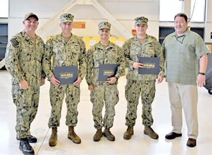 Lt. Cmdr. Gregory L. Crum, Southwest Regional Maintenance Center (SWRMC) Production Officer (far left), and Craig Cunningham, SWRMC Production Department Head (far right), pictured here with SWRMC's first Navy Afloat Maintenance Training Strategy (NAMTS) General Shipboard Welding and Brazing graduates Petty Officer 1st Class Bradley Regan, Petty Officer 1st Class Matthew French, and Petty Officer 2nd Class James Abbott on March 13.