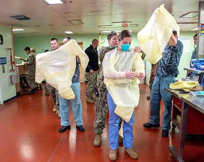 LOS ANGELES (March 29, 2020) Sailors prepare to admit the first patient aboard the hospital ship USNS Mercy (T-AH 19), March 29, 2020. Mercy deployed in support of the nation's COVID-19 response efforts, and will serve as a referral hospital for non-COVID-19 patients currently admitted to shore-based hospitals. This allows shore base hospitals to focus their efforts on COVID-19 cases. One of the Department of Defense's missions is Defense Support of Civil Authorities. DoD is supporting the Federal Emergency Management Agency, the lead federal agency, as well as state, local and public health authorities in helping protect the health and safety of the American people. U.S. Navy photo by MC2 Abigayle Lutz