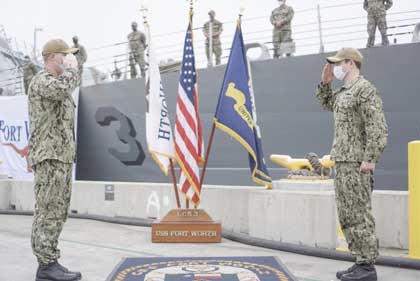 SAN DIEGO (May 1, 2020) -- Cmdr. Jeremiah Petersen, a native of Laurel, Maryland, right, relieves Cmdr. Colin Corridan, a native of Springfield, Massachusetts, left, as commanding officer, USS Fort Worth (LCS 3) during a change of command ceremony. U.S. Navy photo by Lt. j.g. Sheryl Acuna.