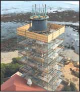 Scaffolding wraps the lighthouse as work to restore the tower is underway. Photo by Neil Gardis.