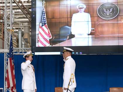SAN DIEGO (Aug. 21, 2020). Vice Chief of Naval Operations Adm. William K. Lescher presides virtually over the change of command ceremony at Naval Information Warfare Systems Command (NAVWAR) as Rear Adm. Douglas Small, right, relieved Rear Adm. Christian Becker as Commander NAVWARSYSCOM. U.S. Navy photo by Rick Naystatt.