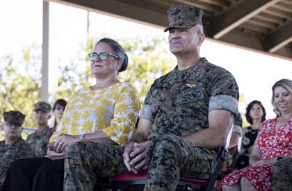 CAMP PENDLETON -- 9/23/2021 -- Lt. Gen. Karsten S. Heckl, former commanding general, I Marine Expeditionary Force (MEF), sits with his wife as Commandant of the Marine Corps Gen. David H. Berger addresses the audience during the I MEF change of command ceremony Sept. 23, 2021 at the 11 Area Parade Deck on Marine Corps Base Camp Pendleton, California. During the ceremony, Heckl relinquished command of I MEF to Lt. Gen. George W. Smith Jr. U.S. Marine Corps photo by Cpl. Jennifer Andrade.