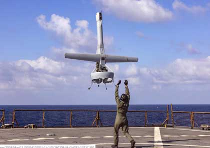 VERTICAL LAUNCH: A V-BAT uncrewed aerial system launches from the dock landing ship USS Carter Hall during operations in the Mediterranean Sea, Feb. 9, 2024. The V-BAT provides the capability to increase maritime awareness through utilization of intelligence, surveillance and reconnaissance sensors. Photo by Marine Corps Cpl. Rafael Brambila-Pelayo 