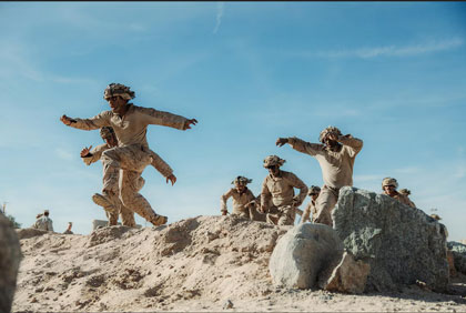 TAKING THE LEAD: Marines run toward the finish line during a 7th Marine Regiment infantry rifle squad competition obstacle course at Marine Corps Air-Ground Combat Center Twentynine Palms, Calif., Dec. 19, 2024.