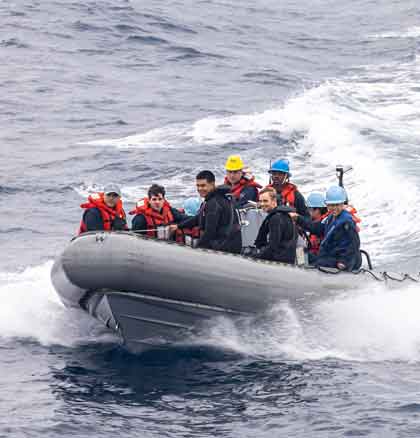 USS Theodore Roosevelt Small Boat Operations SAN DIEGO (Sept. 13, 2025) – U.S. Navy Sailors conduct small boat operations with a rigid-hull inflatable boat off the side of the Nimitz-class aircraft carrier USS Theodore Roosevelt (CVN 71), Sept. 13, 2025. Theodore Roosevelt, flagship of Carrier Strike Group (CSG) 9, is underway conducting exercises to bolster strike group readiness and capability in the U.S. 3rd Fleet area of operations. (U.S. Navy photo by Mass Communication Specialist Seaman Apprentice Tyler Harstad) 