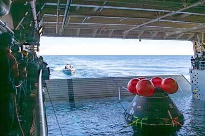 Sailors assigned to amphibious transport dock ship USS John P. Murtha (LPD 26) and NASA engineers prepare to release a crew module test article from the ship’s well deck, Jan. 26, 2026. John P. Murtha is underway in the U.S. 3rd Fleet area of operations performing a just-in-time training in support of U.S. Space Command's human space flight recovery mission to retrieve NASA’s Artemis II crew and spacecraft following their splashdown in the Pacific Ocean. U.S. 3rd Fleet, an integral part of the U.S. Pacific Fleet, leads naval forces in the Indo-Pacific and provides the realistic, relevant training necessary to execute our Navy’s role across the full spectrum of military operations—from combat operations to humanitarian assistance and disaster response. U.S. 3rd Fleet works together with allies and partners to advance freedom of navigation, the rule of law, and other principles that underpin security for the Indo-Pacific region. U.S. Navy photo by MC1 Jomark A. Almazan